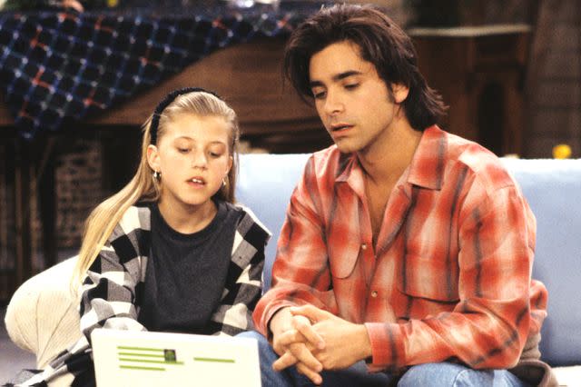 <p>ABC Photo Archives/Disney General Entertainment Content via Getty</p> Jodie Sweetin and John Stamos on a 1993 episode of 'Full House'