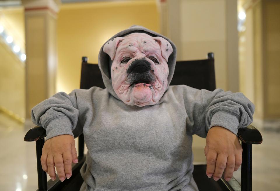 Sheri Wise is transformed into a bulldog by makeup artist Nathan Bright on Tuesday during Oklahoma Film Day at the Capitol.