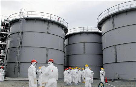 Tanks of radiation-contaminated water are seen at the Tokyo Electric Power Co (TEPCO)'s tsunami-crippled Fukushima Daiichi nuclear power plant in Fukushima prefecture in this file photo released by Kyodo on March 1, 2013. REUTERS/Kyodo/Files