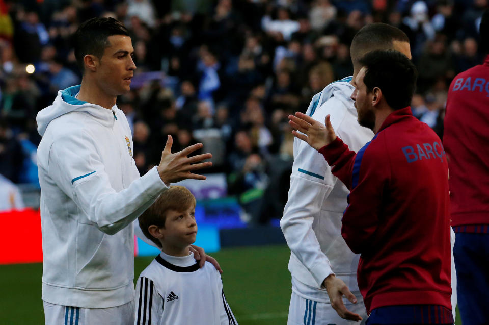 Cristiano Ronaldo (left) and Lionel Messi finally get to team up on our worldwide best XI of the decade. (REUTERS/Stringer)