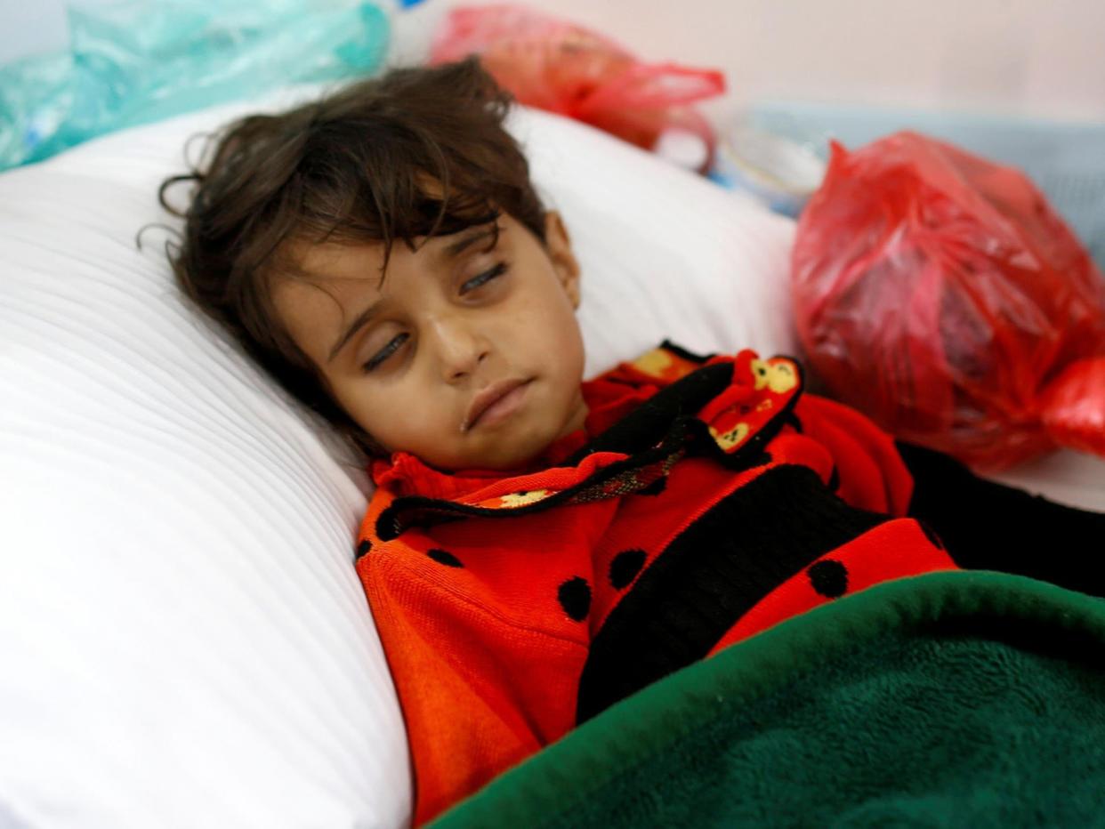 A girl infected with cholera lies on the ground at a hospital in Sanaa, Yemen: Reuters