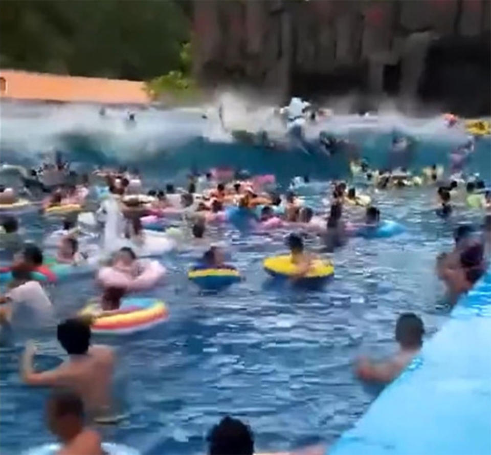 A wave machine malfunctioned, sending a 3-metre ‘tsunami’ into and pool and wiping out tourists in northern China's Shuiyun Water Park. Source: Newsflare