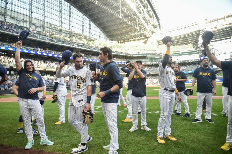 Oct 1, 2023; Milwaukee, Wisconsin, USA; Milwaukee Brewers players wave to fans after their final regular season game against the Chicago Cubs at American Family Field. Mandatory Credit: Benny Sieu-USA TODAY Sports