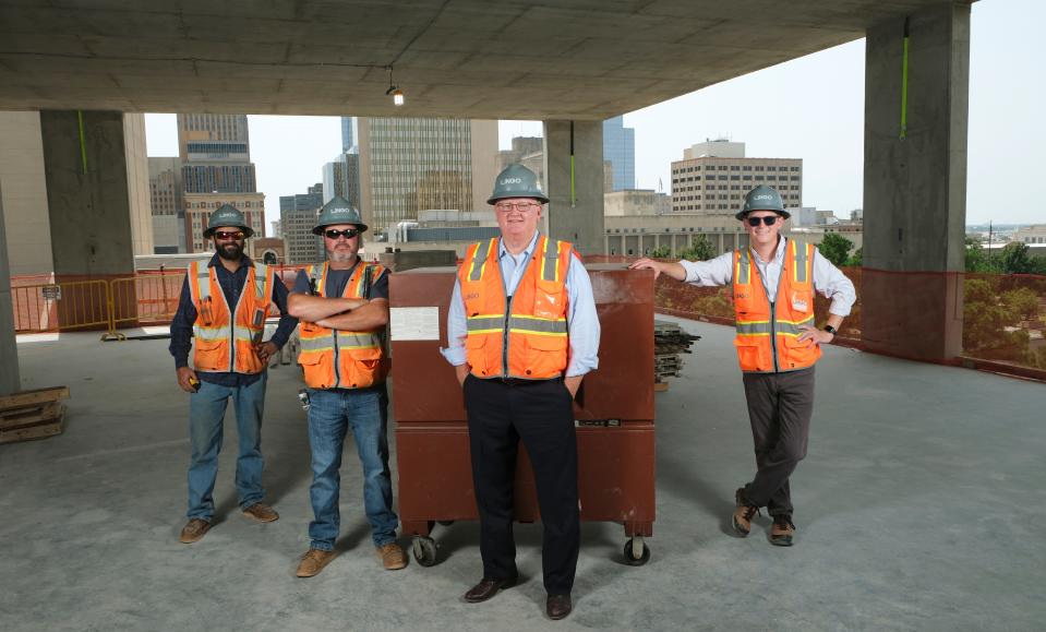 From left, Jordan Leach, Brett Perry, Stan Lingo and Collins Peck stand Aug. 18 on the fourth floor of Citizen's Tower, which is under construction at NW 5 and Robinson Avenue.