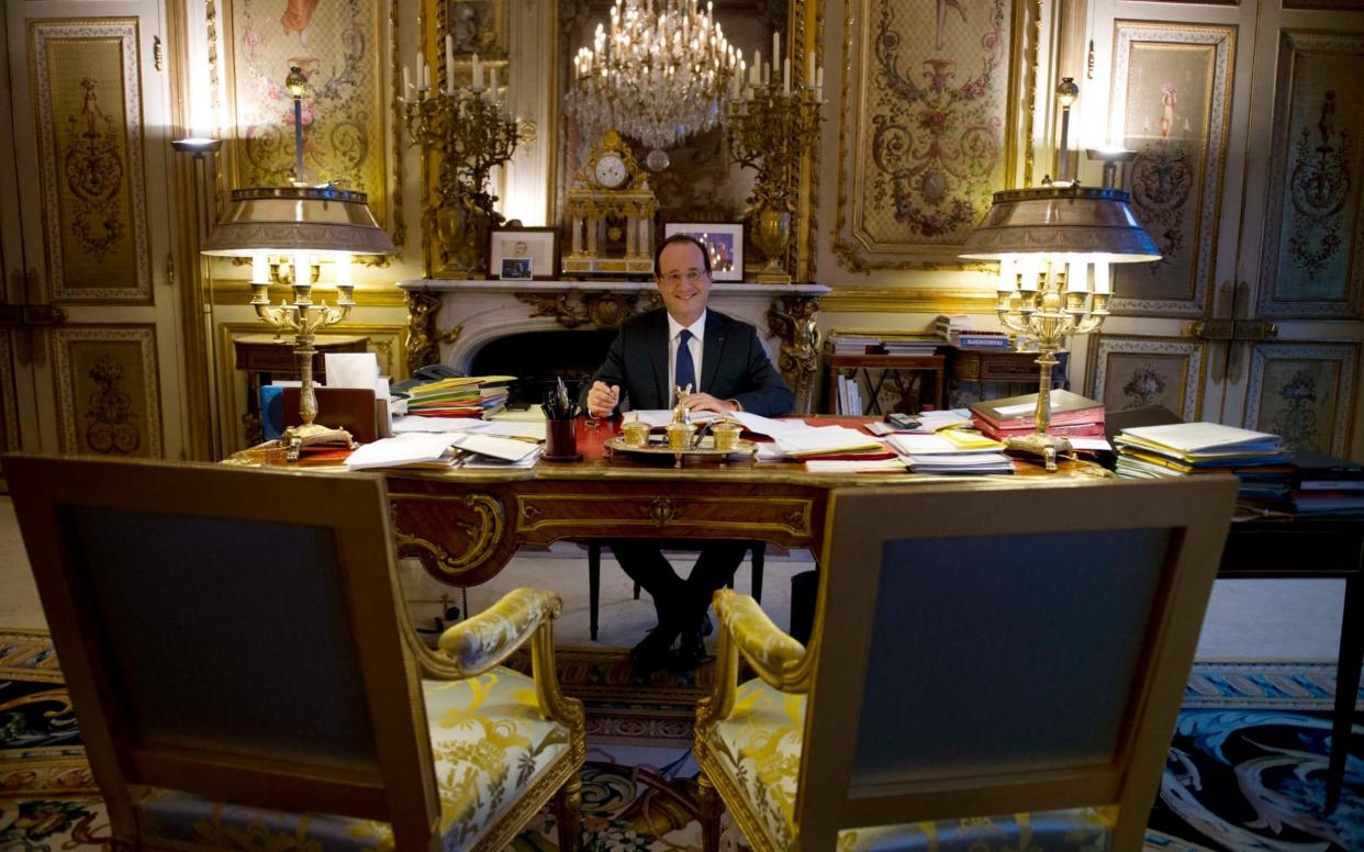President Hollande in his office during a photo session at the Elysee Palace in 2012. - Reuters