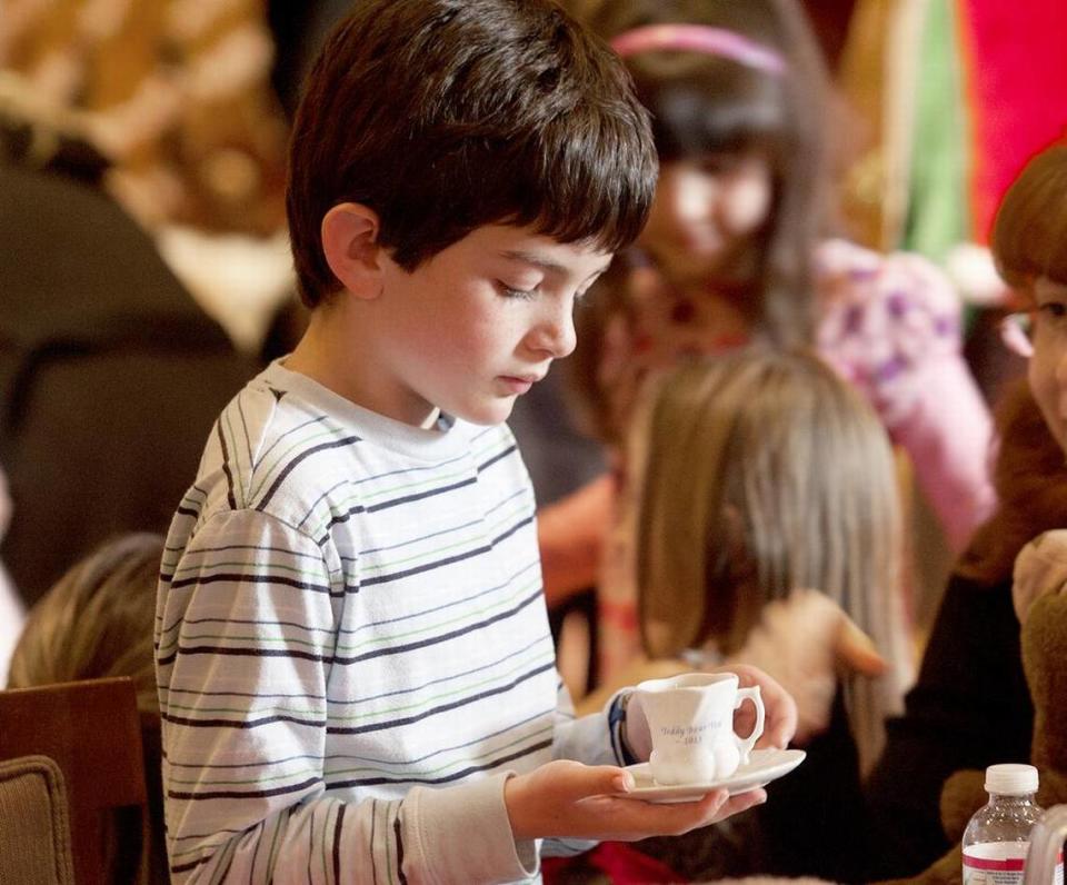 Trevor Taylor, 7, of Arroyo Grande lifts his teacup.