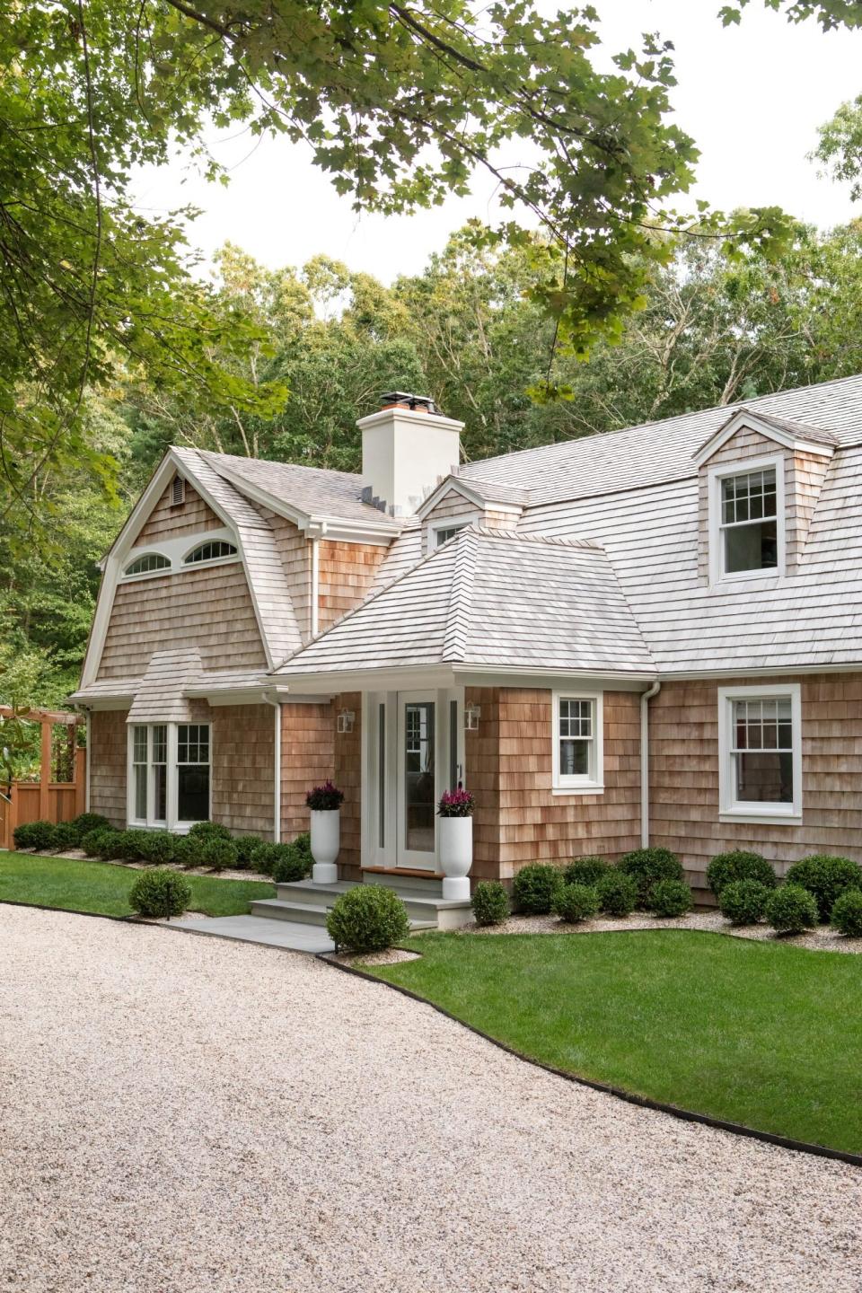 house with shingles and simple landscaping