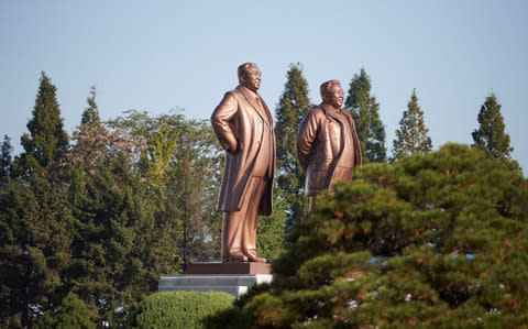 Statues of former leaders Kim Il Sung and Kim Jong Il  - Credit: REUTERS 