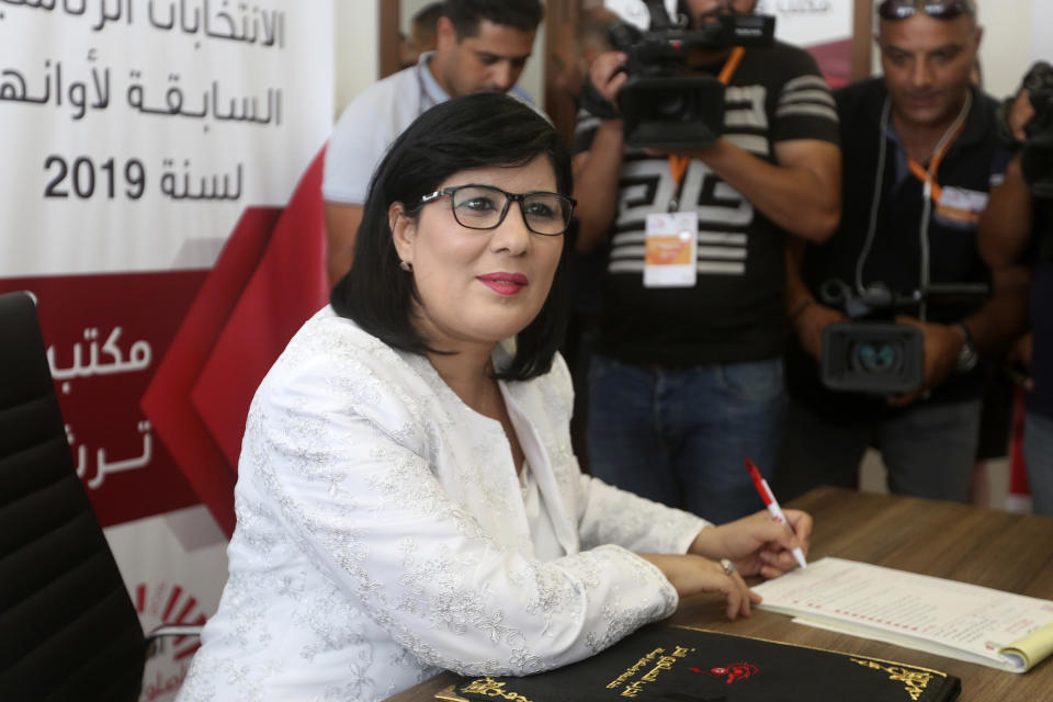 FILE - In this Aug. 2, 2019 file photo, President of the Free Destourian Party (PDL) Abir Moussi submits her candidacy for the upcoming presidential elections in Tunis, Tunisia. Since winning a parliamentary seat in 2019, Tunisian lawmaker Abir Moussi has become one of the country’s most popular, and most controversial, politicians, riding a wave of nostalgia for a more stable and prosperous time, just as Tunisia marks 10 years since protesters overthrew autocratic former President Zine El Abidine Ben Ali. Since 2011, Tunisia has been plagued by sinking wages, growing joblessness and worsening public services. Unemployment has risen amid the coronavirus pandemic from 15% to 18%. Attempts to migrate to Europe by sea have soared. (AP Photo/File)