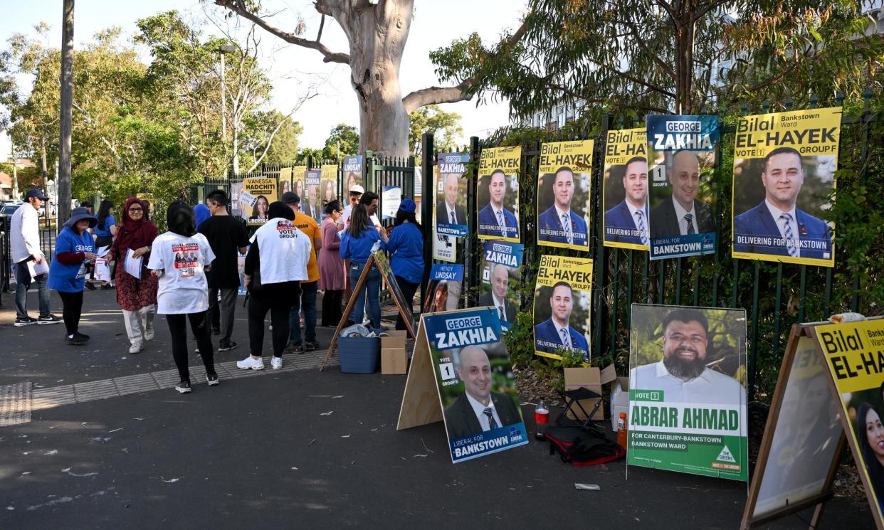 <span>Placards outside Bankstown public school on Saturday.</span><span>Photograph: Steven Markham/AAP</span>