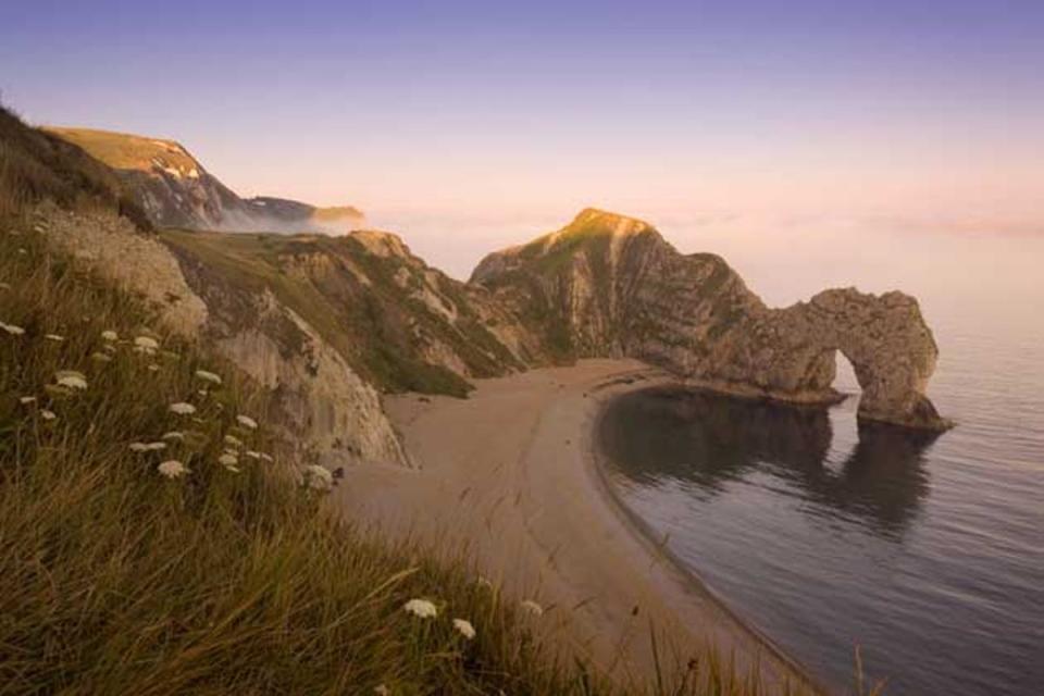 The Jurassic Coast is a haven for restorative swimming and paddle boarding (British Tourist Authority)