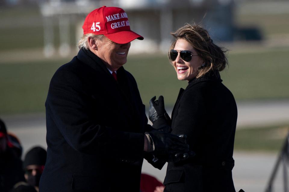 Hope Hicks smiles at US President Donald Trump during a Make America Great Again rally at Dubuque Regional Airport on November 1, 2020, in Dubuque, Iowa. She was the White House communications director until March 2018.