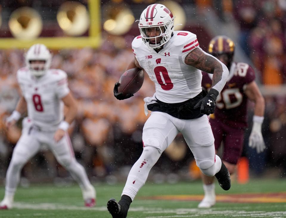 Wisconsin running back Braelon Allen (0) runs for a first down during the second quarter of their game Saturday, November 25, 2023 at Huntington Bank Stadium in Minneapolis, Minnesota. Wisconsin beat Minnesota 28-14.