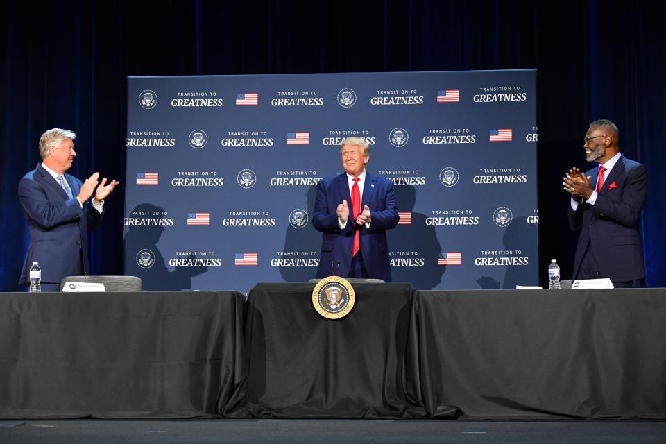 Then-President Donald Trump (C), flanked by Pastor Robert Morris (L) and Bishop Harry Jackson (R), hosts a roundtable with faith leaders, law enforcement officials, and small business owners at Gateway Church in Dallas, Texas, on June 11, 2020.