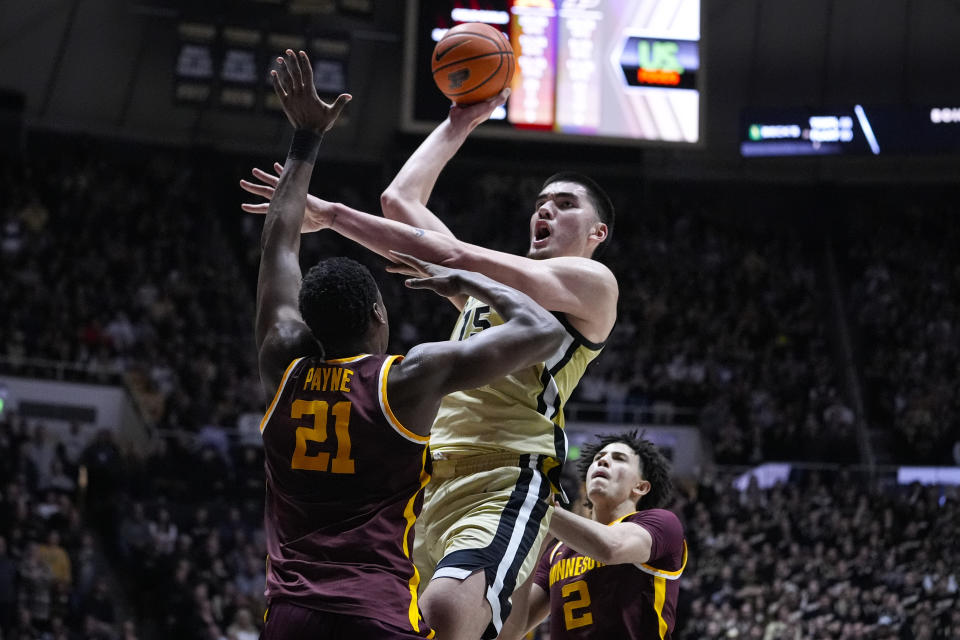 Purdue center Zach Edey (15) shoots over Minnesota forward Pharrel Payne (21) during the second half of an NCAA college basketball game in West Lafayette, Ind., Thursday, Feb. 15, 2024. (AP Photo/Michael Conroy)