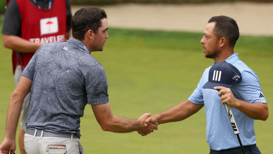 Schauffele and Bradley shake hands 