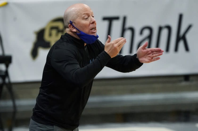 UCLA head coach Mick Cronin directs his players against Colorado in the first half of an NCAA college basketball game Saturday, Feb. 27, 2021, in Boulder, Colo. (AP Photo/David Zalubowski)