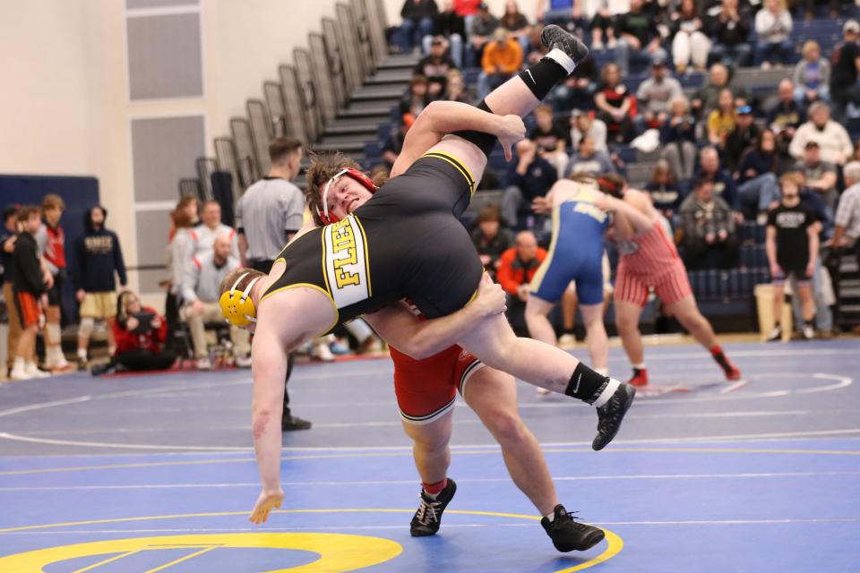 Clyde's Jack Blue is controled by Port Clinton's Dagan Meyers in a 215 pound match.