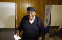 South African Archbishop Desmond Tutu smiles after marking his ballot during elections in Cape Town, South Africa, Wednesday, May 7, 2014. (AP Photo/Schalk van Zuydam)
