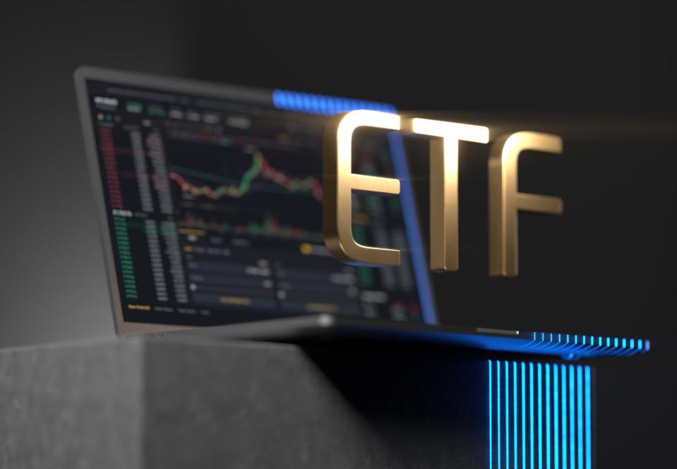 Gold ETF logo and laptop.