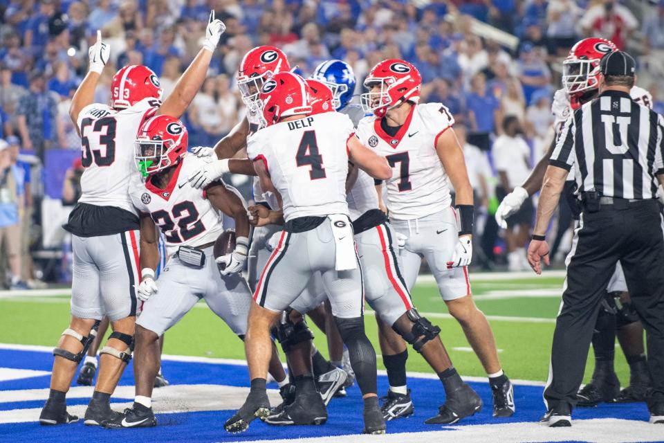 Sep 14, 2024; Lexington, Kentucky, USA; Georgia Bulldogs running back Branson Robinson (22) celebrates with teammates after he scores a touchdown during the fourth quarter against the Kentucky Wildcats at Kroger Field. Mandatory Credit: Tanner Pearson-Imagn Images