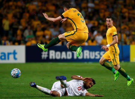 Football Soccer - Australia vs United Arab Emirates - 2018 World Cup Qualifying Asian Zone - Group B - Sydney Football Stadium, Sydney, Australia - 28/3/17 - Australia's Brad Smith is challenged by UAE's Khamis Esmaeel. REUTERS/David Gray