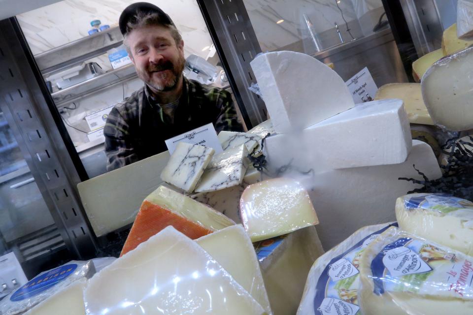 Long Branch Gourmet owner David Enright cheese case at the Ocean Avenue North shop Tuesday, November 8, 2022.  The shop opened earlier this year and features cheese & charcuterie; deli and specialty foods store.