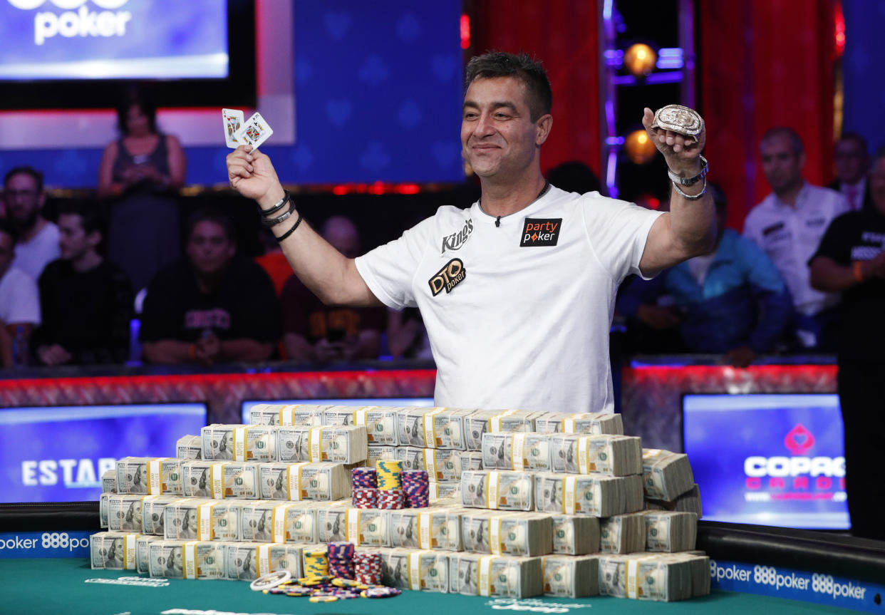 Hossein Ensan, of Germany, poses with the bracelet after winning the World Series of Poker main event, Wednesday, July 17, 2019, in Las Vegas. (AP Photo/John Locher)