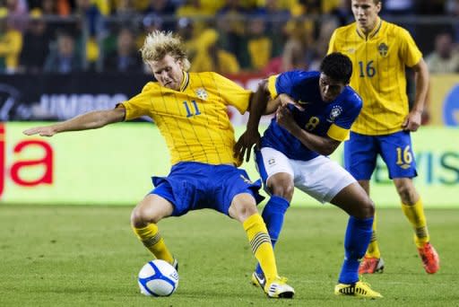 Brazil's Paulinho (R) battles for the ball with Sweden's Ola Toivonen during the friendly match at the Rasunda stadium in Solna near Stockholm on August 15, 2012. Brazil won 3-0. With Pele and other members of that team looking on, second-half replacement Alexandre Pato scored a quick-fire brace in the 84th and 87th minutes, the latter a penalty, to secure victory