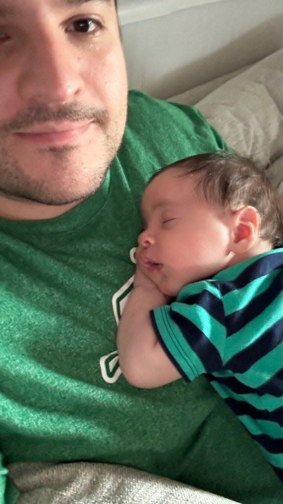 Joe shares a rare quiet, peaceful moment with then 3-month-old Remy. Very rare.