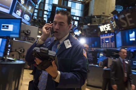 Traders work on the floor of the New York Stock Exchange June 24, 2014. REUTERS/Brendan McDermid