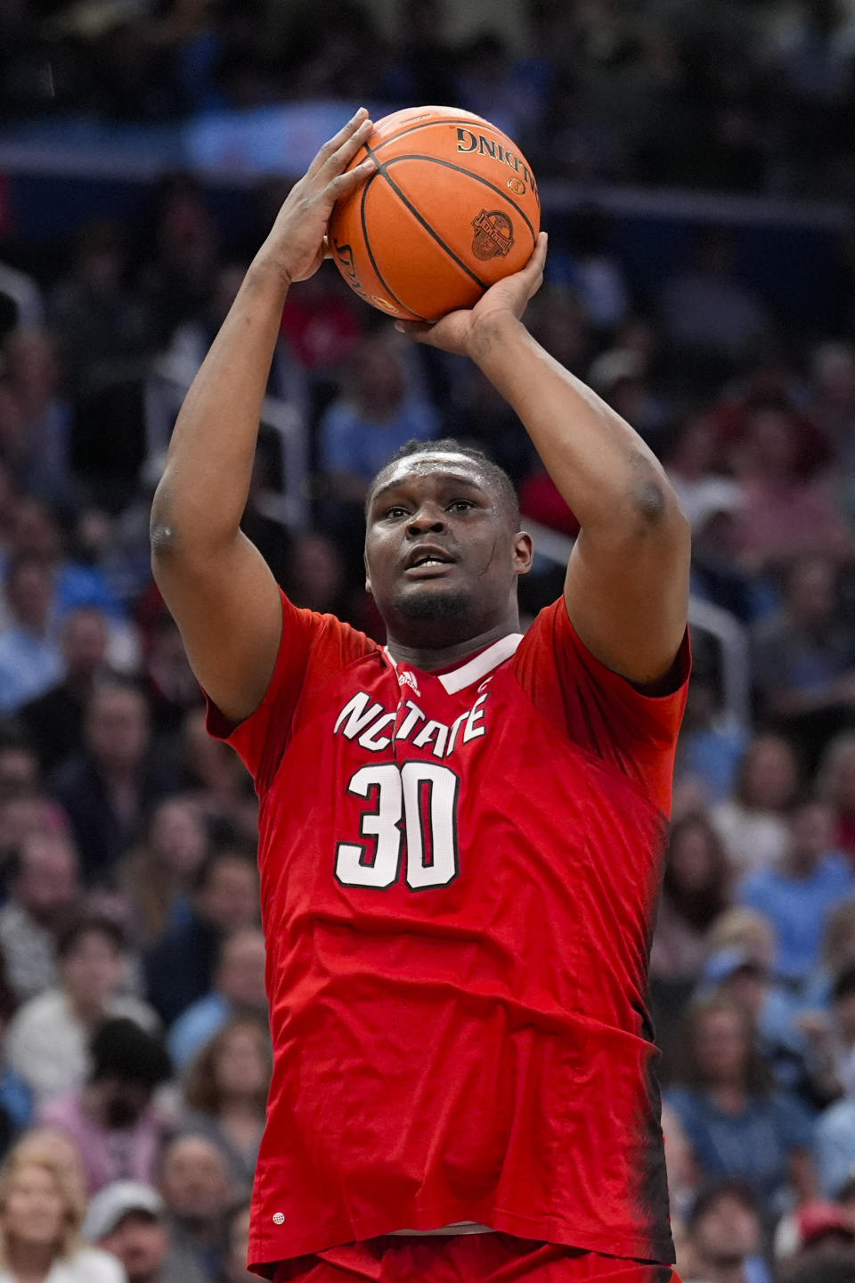 North Carolina State forward DJ Burns Jr. (30) takes a shot against North Carolina during the first half of an NCAA college basketball game in the championship of the Atlantic Coast Conference tournament, Saturday, March 16, 2024 in Washington. (AP Photo/Alex Brandon)