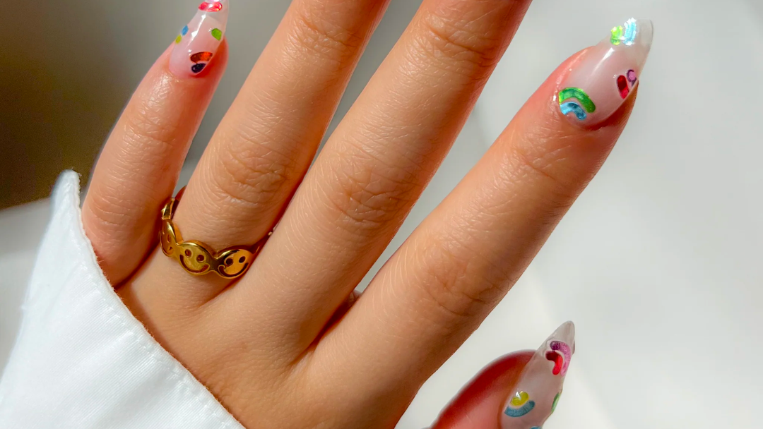 a woman's hand with painted nails