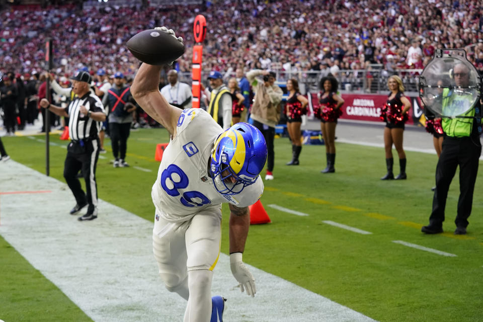 Los Angeles Rams tight end Tyler Higbee celebrates after scoring a touchdown during the first half of an NFL football game against the Arizona Cardinals, Sunday, Nov. 26, 2023, in Glendale, Ariz. (AP Photo/Ross D. Franklin)