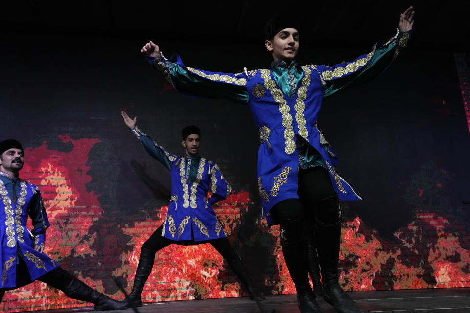 Iranian dancers perform in a ceremony celebrating Zoroastrians ancient mid-winter Sadeh festival in the outskirts of Tehran, Iran, Tuesday, Jan. 30, 2024. Hundreds of Zoroastrian minorities gathered after sunset to mark their ancient feast, creation of fire, dating back to Iran's pre-Islamic past. (AP Photo/Vahid Salemi)