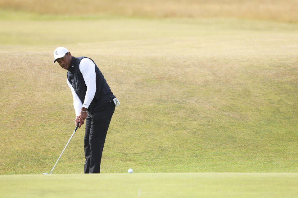 U.S golfer Tiger Woods putting on the 7th green during a practice round at the British Open golf championship on the Old Course at St. Andrews, Scotland, Monday July 11, 2022. The Open Championship returns to the home of golf on July 14-17, 2022, to celebrate the 150th edition of the sport's oldest championship, which dates to 1860 and was first played at St. Andrews in 1873. (AP Photo/Peter Morrison)