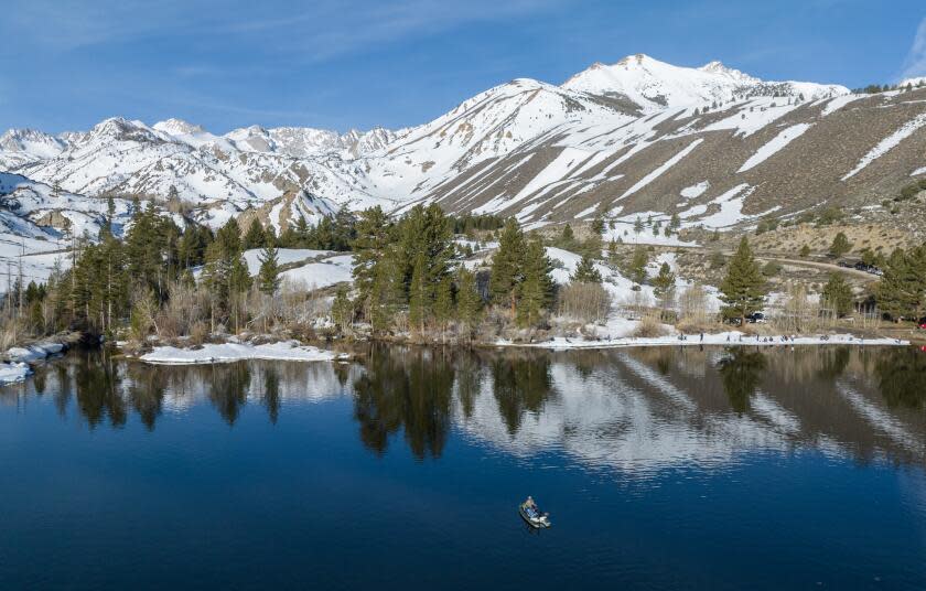 Bishop, CA - April 29: The Sierra Nevada crest is reflected on Intake 2 near Aspendell on the official opening day of the Eastern Sierra trout season Saturday, April 29, 2023 in Bishop, CA. (Brian van der Brug / Los Angeles Times)