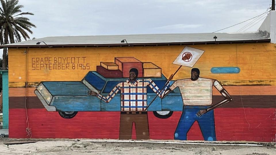 A mural by the Date Farmers is painted on the north-facing wall of the Casa del Trabajador, which was once Cesar Chavez's working space in Coachella, Calif.