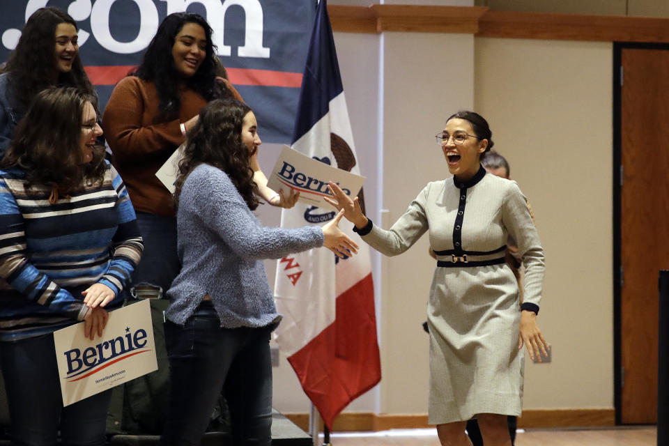 Rep. Alexandria Ocasio-Cortez, D-N.Y., walks to the podium during a campaign event in support of Democratic presidential candidate Sen. Bernie Sanders, I-Vt., Saturday, Jan. 25, 2020, on the campus of the University of Northern Iowa in Cedar Falls, Iowa. (AP Photo/Marcio Jose Sanchez)