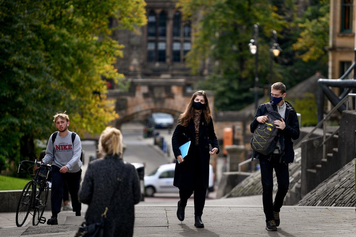 Members of the public are seen at Glasgow University: Getty Images