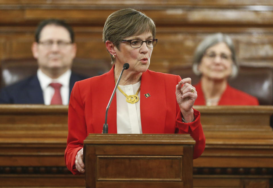 Kansas Gov. Laura Kelly gives her first State of the State address to lawmakers on the floor of the Kansas House on Wednesday, Jan. 16, 2019, in Topeka, Kan. (Chris Neal/The Topeka Capital-Journal via AP)