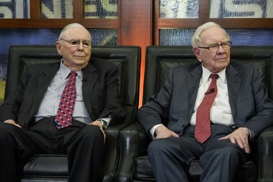 Berkshire Hathaway Chairman and CEO Warren Buffett, right, and his Vice Chairman Charlie Munger, left, listen to a question during an interview in Omaha, Neb., Monday, May 7, 2018, with Liz Claman on Fox Business Network's 