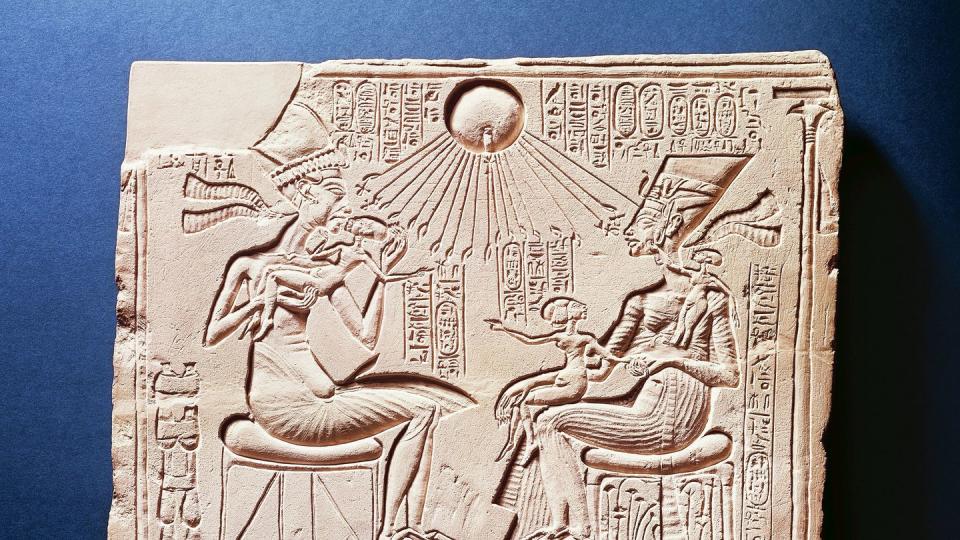 egyptian civilization, relief portraying king amenhotep iv with his wife nefertiti and their children under rays of aten, from tell el amarna