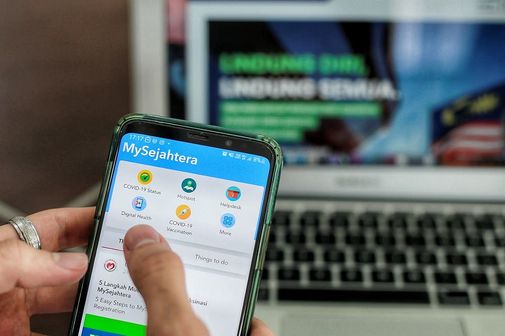 The section for Covid-19 vaccination registration via the MySejahtera mobile application is displayed on a mobile phone in Kuala Lumpur February 24, 2021. —Picture by Ahmad Zamzahuri