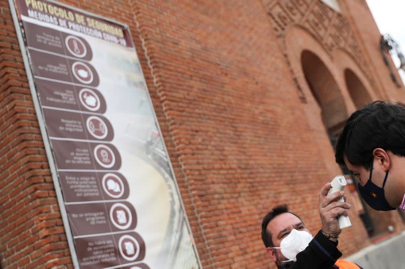 A man has his temperature checked before entering Las Ventas bullring ahead of the first bullfight since the start of the COVID-19 pandemic, in Madrid