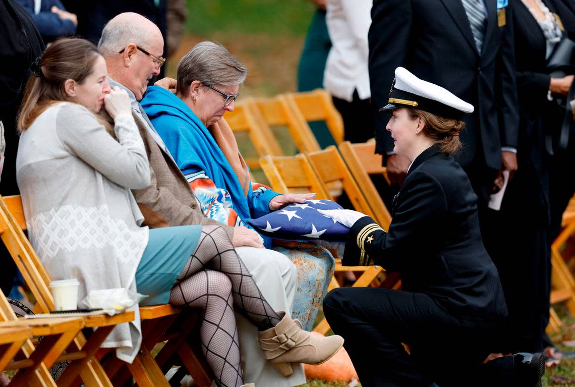 The Navy honor guard presents Mary Marshall’s family an American flag during a memorial service for Marshall at Dix Park in Raleigh, N.C., Saturday, Oct. 29, 2022. Marshall was one of the five people killed in a mass shooting on Oct. 13.