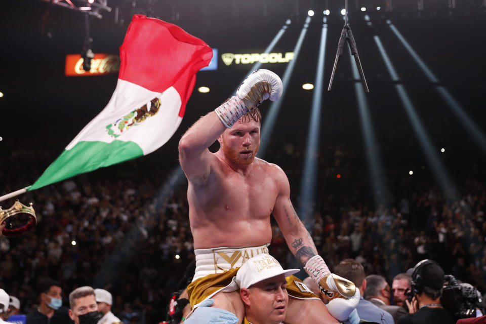 Canelo Alvarez, of Mexico, celebrates after defeating Caleb Plant by TKO in a super middleweight title unification fight Saturday, Nov. 6, 2021, in Las Vegas. (AP Photo/Steve Marcus)