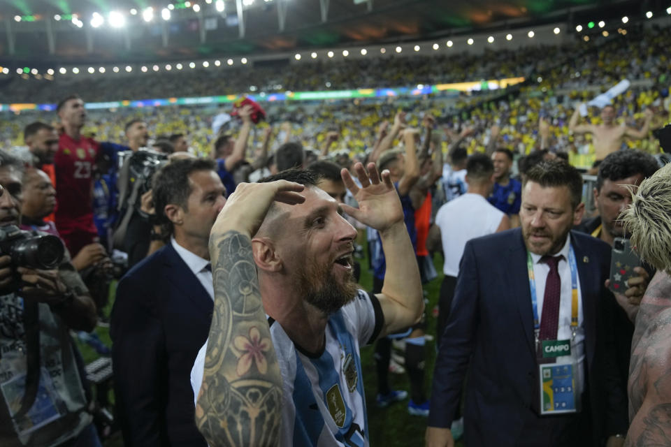 Argentina's Lionel Messi and teammates celebrate their team's 1-0 victory over Brazil at the end of a qualifying soccer match for the FIFA World Cup 2026 at Maracana stadium in Rio de Janeiro, Brazil, Tuesday, Nov. 21, 2023. (AP Photo/Silvia Izquierdo)