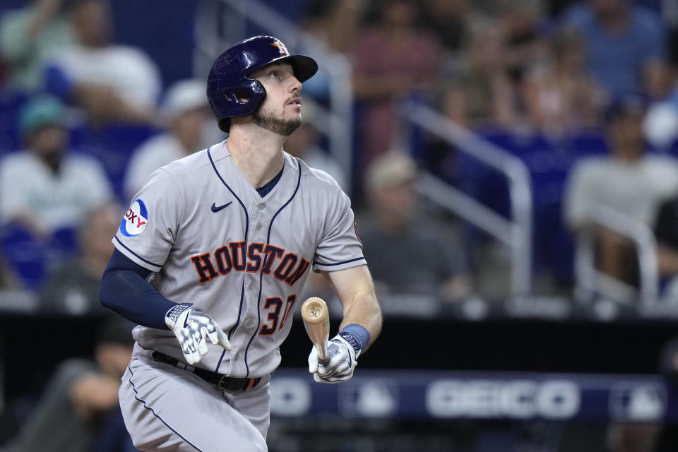 Houston Astros' Kyle Tucker watches the ball as he hits a home run during the first inning of a baseball game against the Miami Marlins, Wednesday, Aug. 16, 2023, in Miami. (AP Photo/Wilfredo Lee)