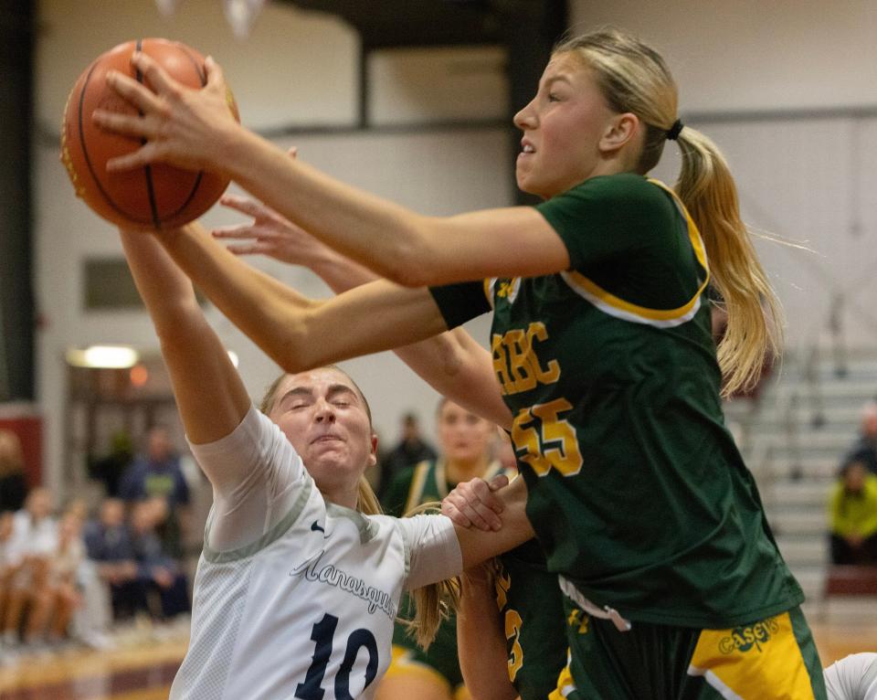 RBC Addy Nyemchek beats Olivia Shaughnessy to a rebound. Red Bank Catholic vs Manasquan in SCT Girls Basketball Semifinal on February 15, 2024 in Red Bank. NJ.